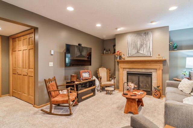 carpeted living room featuring a fireplace