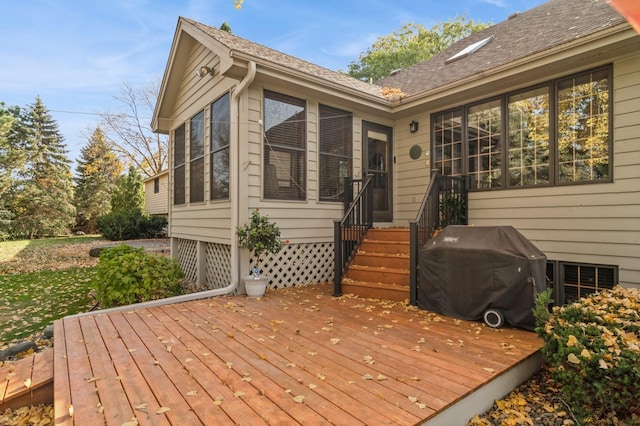 wooden deck featuring area for grilling