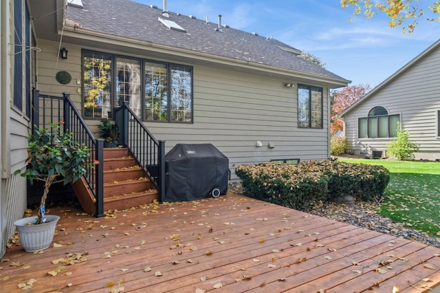 wooden terrace with a grill