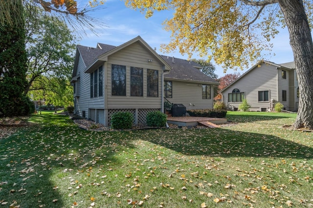 back of house with a yard