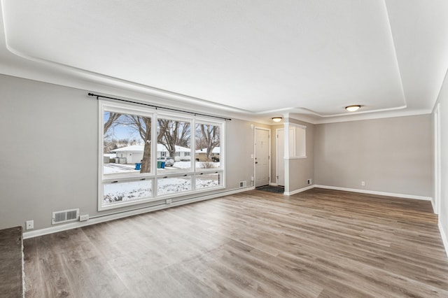 unfurnished living room with hardwood / wood-style flooring