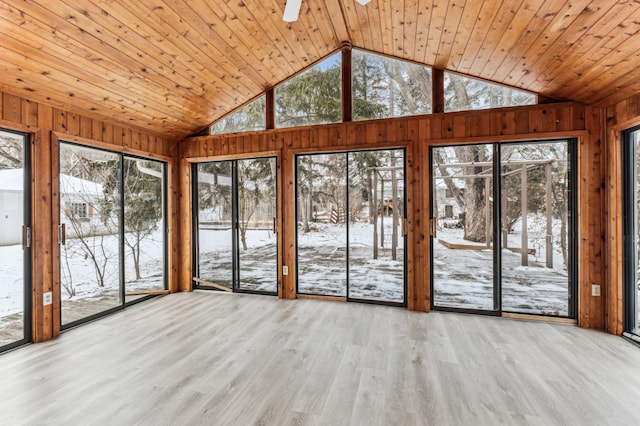 unfurnished sunroom featuring vaulted ceiling, wooden ceiling, and ceiling fan