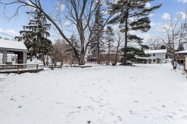 view of yard layered in snow