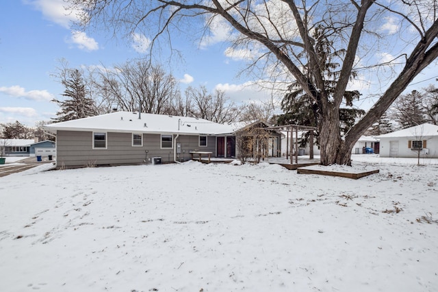 view of snow covered house