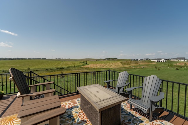 wooden deck featuring a rural view