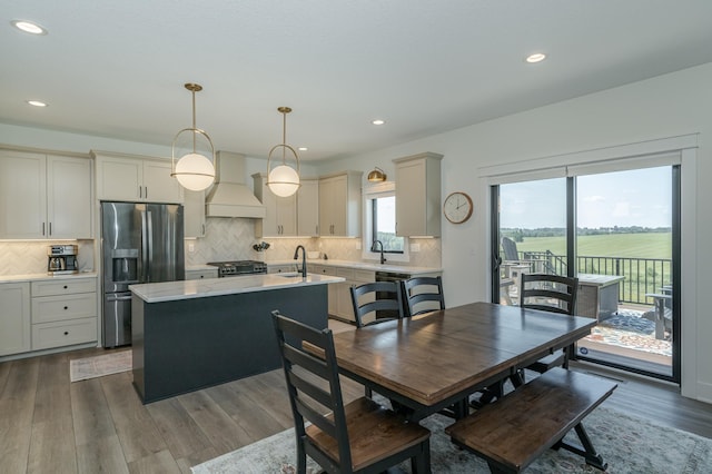 dining area featuring recessed lighting and wood finished floors