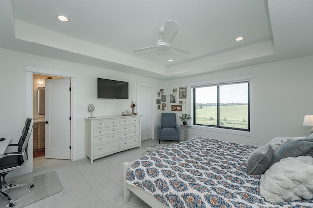 bedroom featuring ceiling fan, recessed lighting, a raised ceiling, and light colored carpet