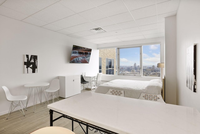 bedroom with a paneled ceiling