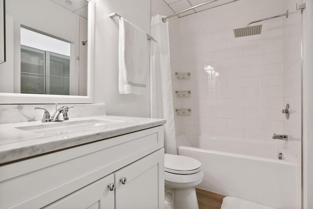 full bathroom featuring shower / bath combo, toilet, and vanity