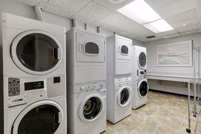 washroom featuring stacked washer / dryer and independent washer and dryer