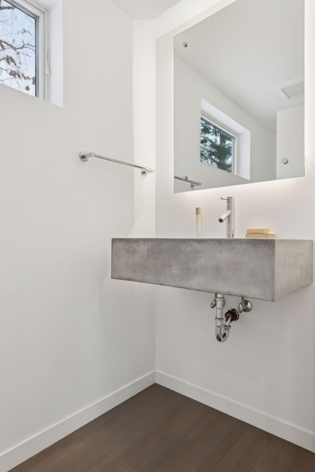 bathroom with hardwood / wood-style flooring