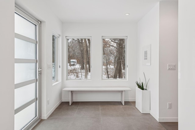 hallway with light tile patterned floors