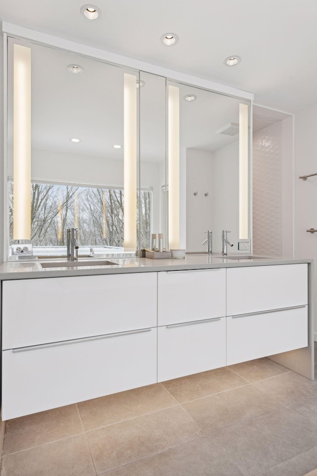 bathroom with vanity and tile patterned floors