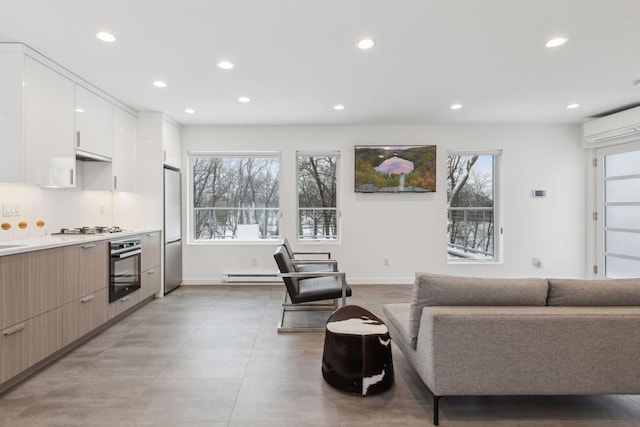 living room with a baseboard radiator and a wall unit AC