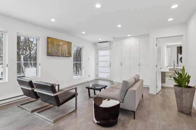 living room featuring an AC wall unit