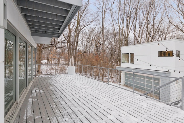 view of snow covered deck