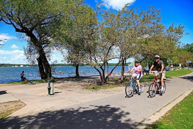 surrounding community with a water view