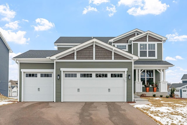 craftsman-style house featuring a garage and covered porch