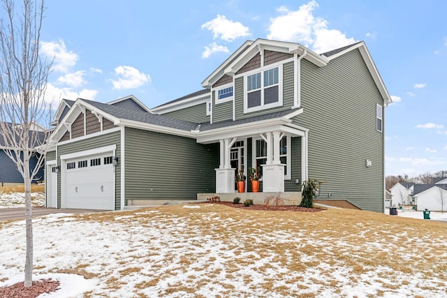 craftsman house with a garage and covered porch