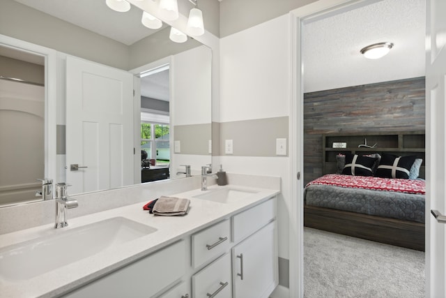 bathroom featuring a textured ceiling and vanity