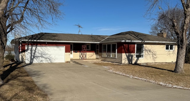 ranch-style home with covered porch and a garage