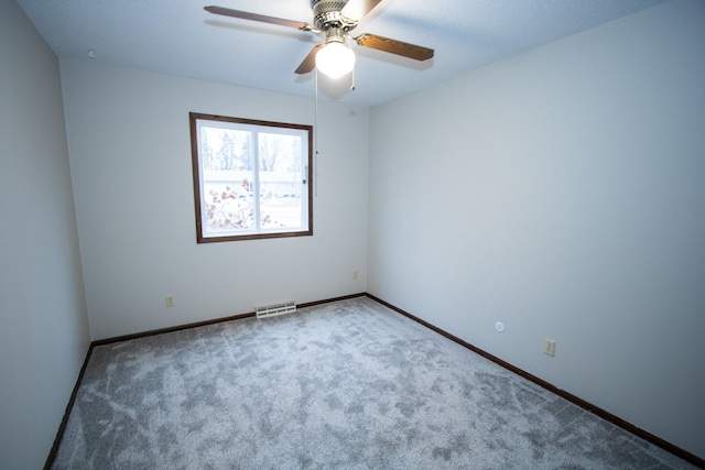 unfurnished room with carpet floors and ceiling fan