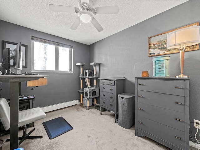 home office featuring light carpet, ceiling fan, a baseboard radiator, and a textured ceiling