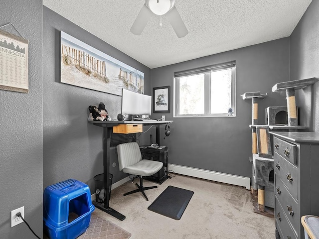 office area featuring a baseboard radiator, light carpet, ceiling fan, and a textured ceiling