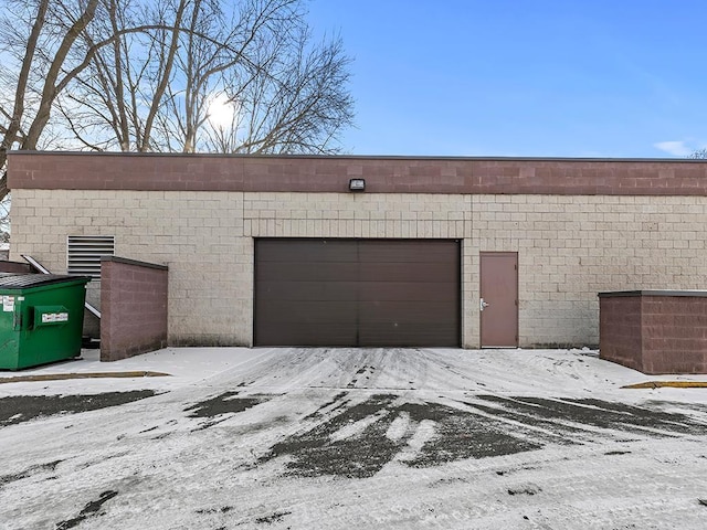 view of snow covered garage