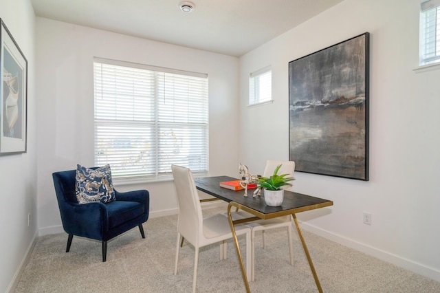 view of carpeted dining space