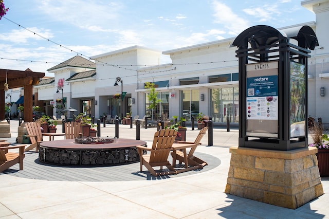 view of patio with an outdoor fire pit