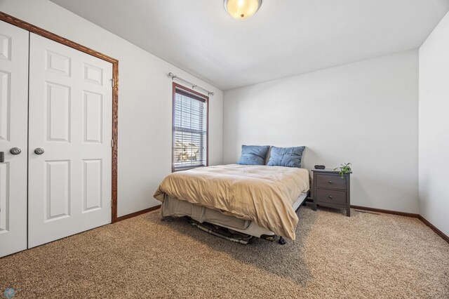 carpeted bedroom with a closet