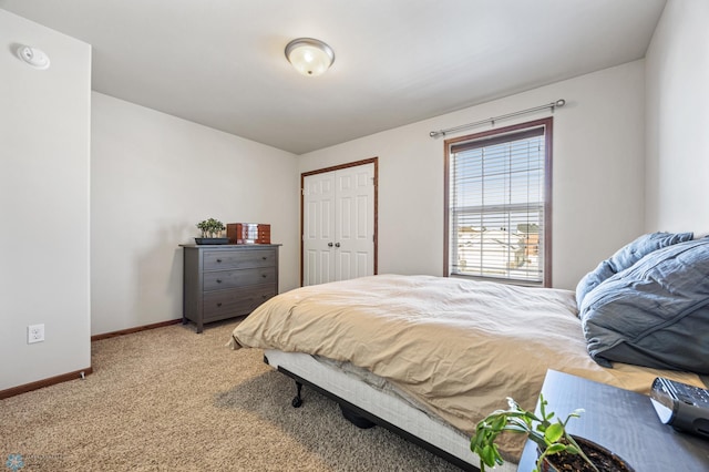 carpeted bedroom with a closet