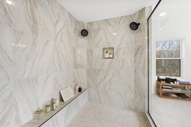 bathroom with tiled shower