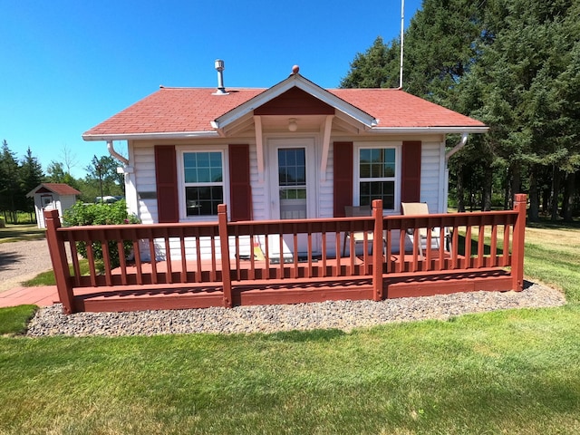 rear view of house with a yard