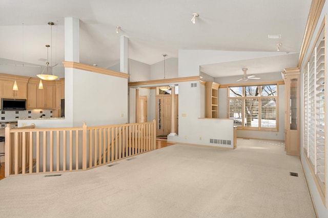 living area featuring lofted ceiling, visible vents, ceiling fan, and light carpet