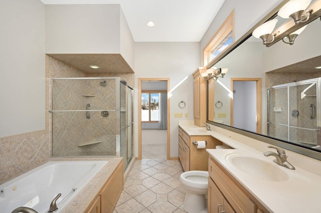 bathroom with tile patterned floors, a shower stall, and vanity