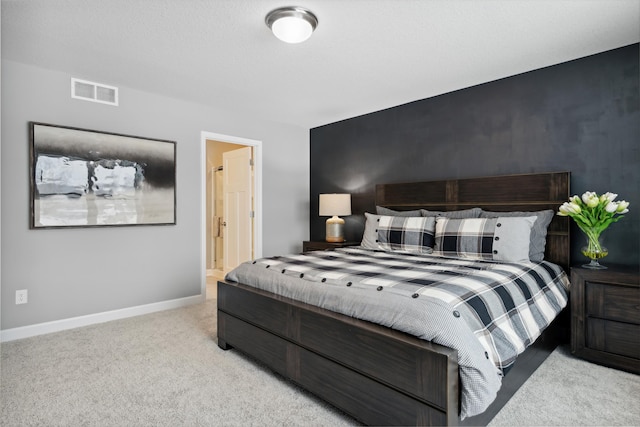 bedroom featuring light carpet