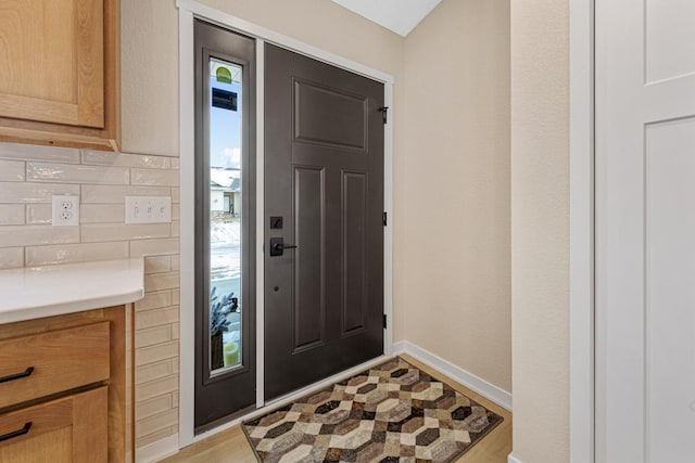 2834 Meadowview Ln NE, Owatonna, MN 55060 - entryway featuring baseboards and light wood finished floors