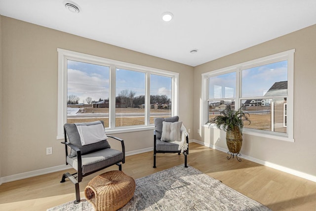 2834 Meadowview Ln NE, Owatonna, MN 55060 - sitting room with light wood-type flooring, baseboards, and recessed lighting