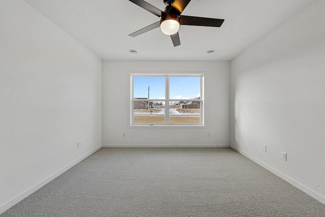 2834 Meadowview Ln NE, Owatonna, MN 55060 - spare room with a ceiling fan, light carpet, and baseboards