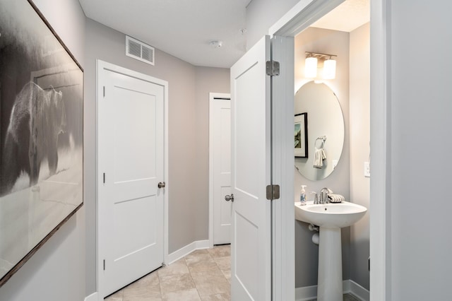 bathroom featuring tile patterned flooring