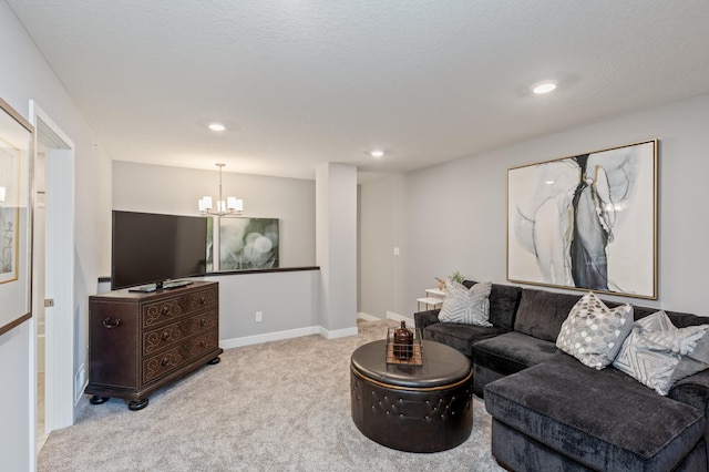 carpeted living room with a chandelier