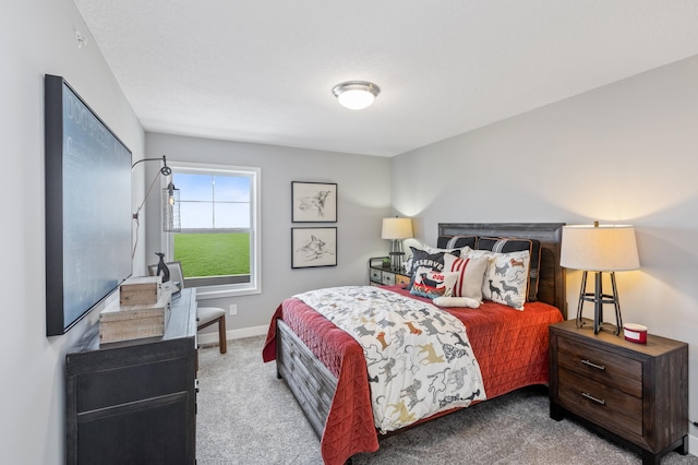 bedroom featuring light colored carpet