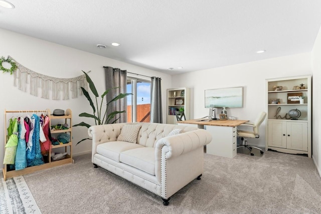 carpeted living area with recessed lighting