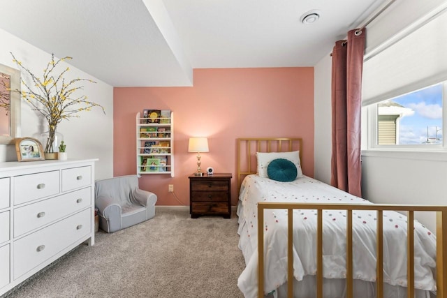 bedroom featuring light colored carpet