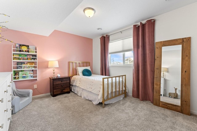 bedroom with carpet floors and baseboards