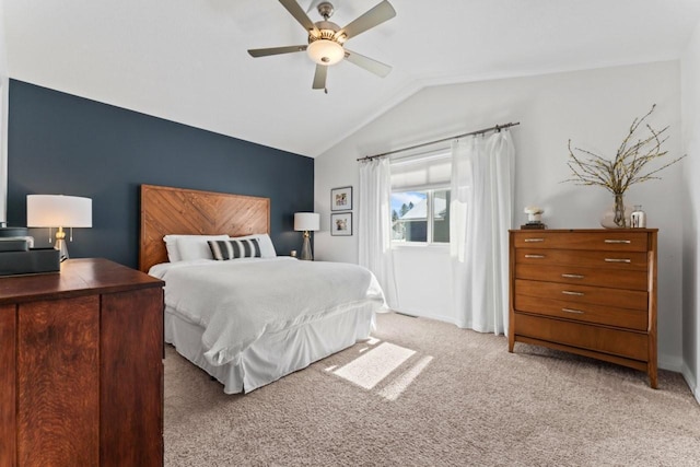 bedroom featuring vaulted ceiling, ceiling fan, baseboards, and light colored carpet