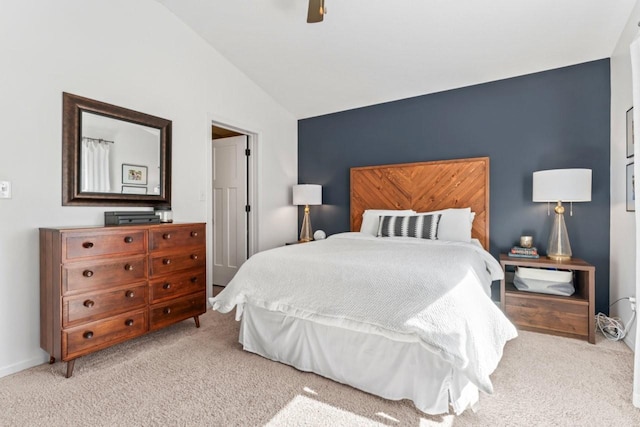 carpeted bedroom with lofted ceiling, ceiling fan, and baseboards