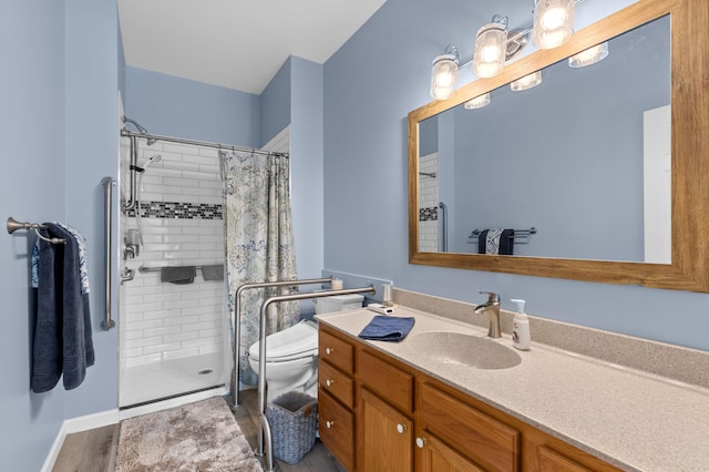 bathroom with vanity, curtained shower, and toilet